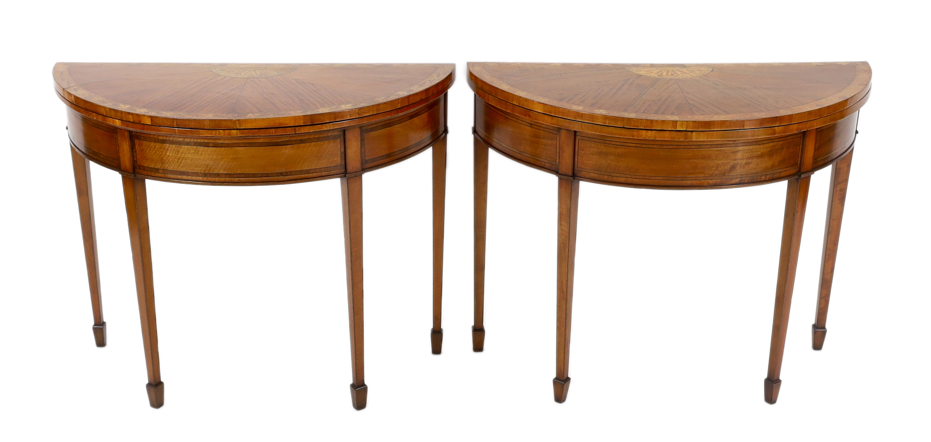 A pair of Edwardian Sheraton revival marquetry inlaid satinwood card tables